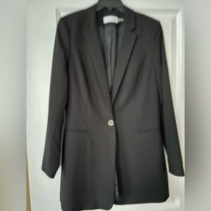 Calvin Klein black long sleeve blazer with button closure. Size 10